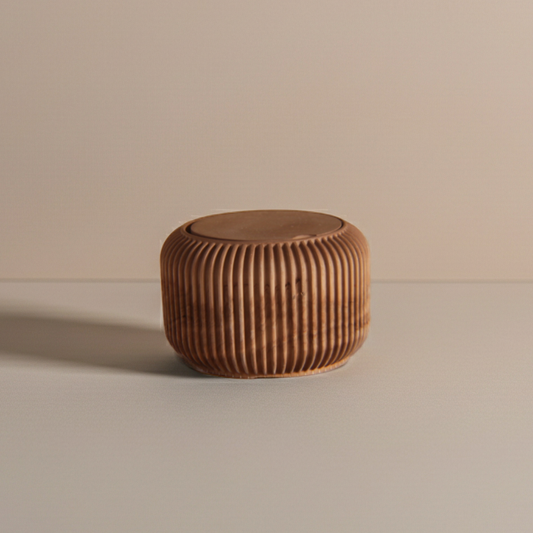 Rich brown eco-resin candle vessel with ribbed texture on a beige background